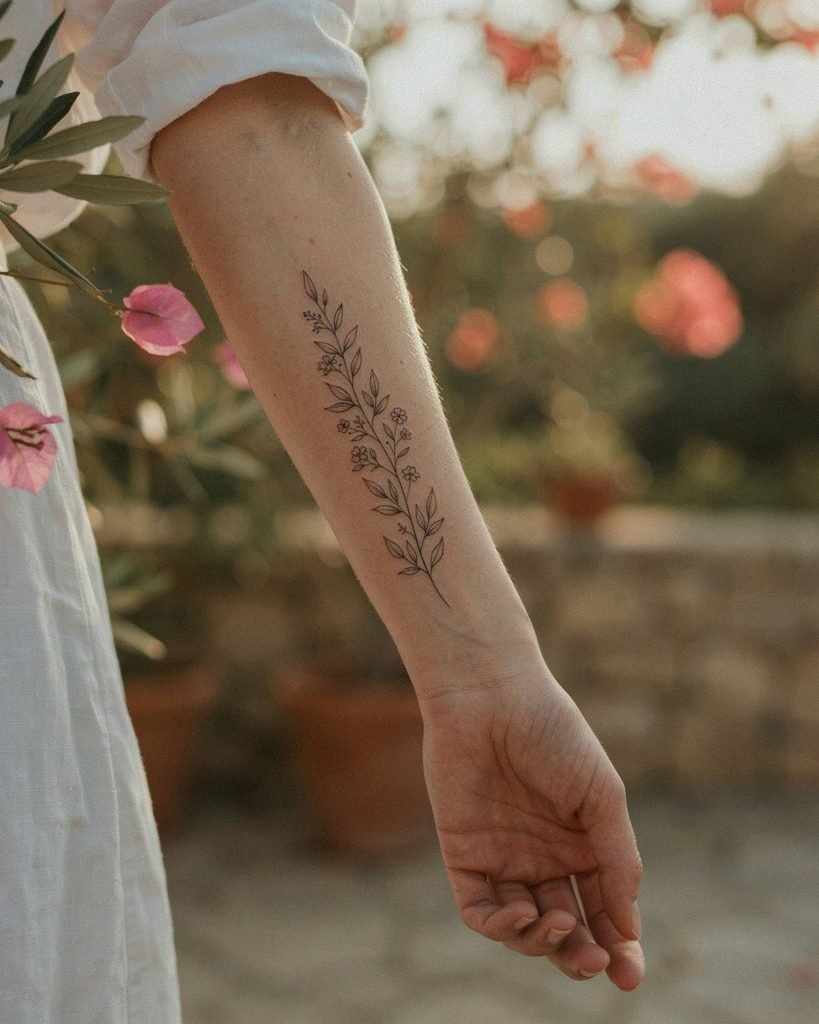 Fine-line botanical tattoo